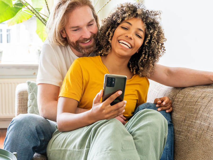 Couple smiling on couch