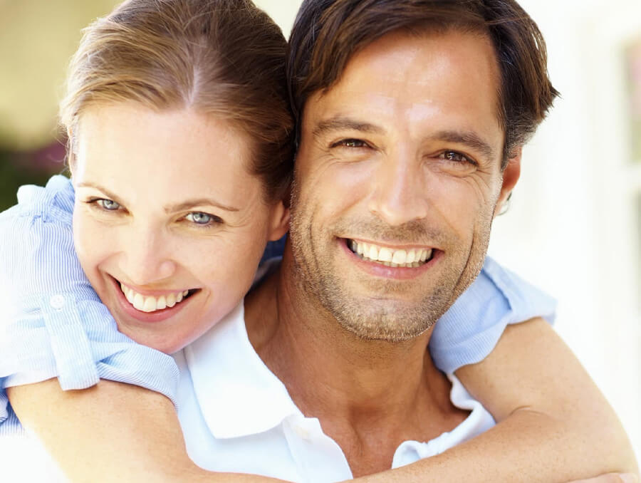 Couple hugging and smiling