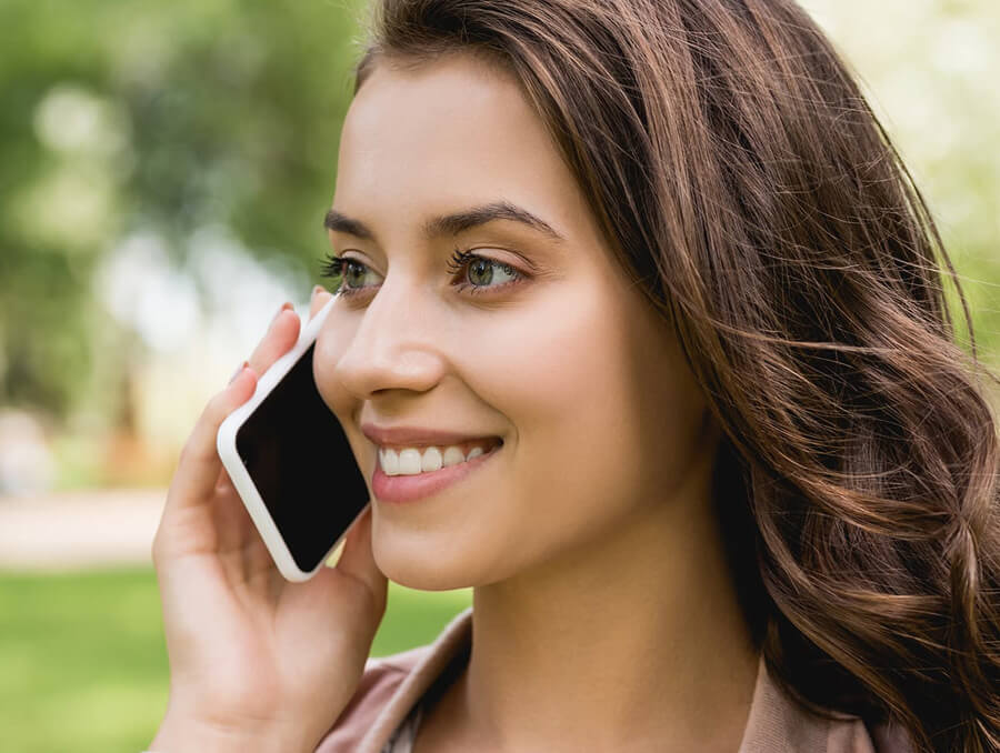 Girl outside on iPhone