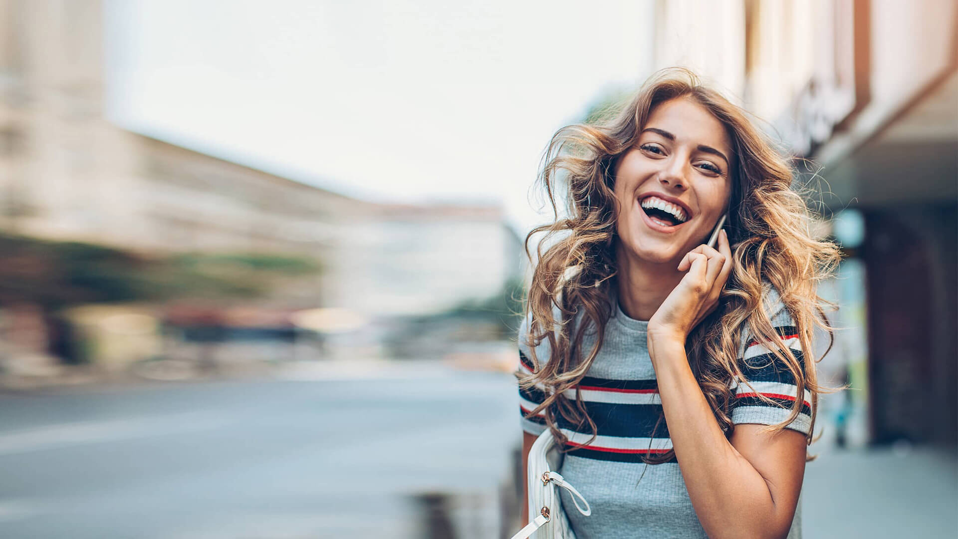 Woman smiling on phone